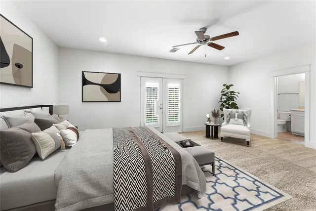 a bedroom with a bed and a couch