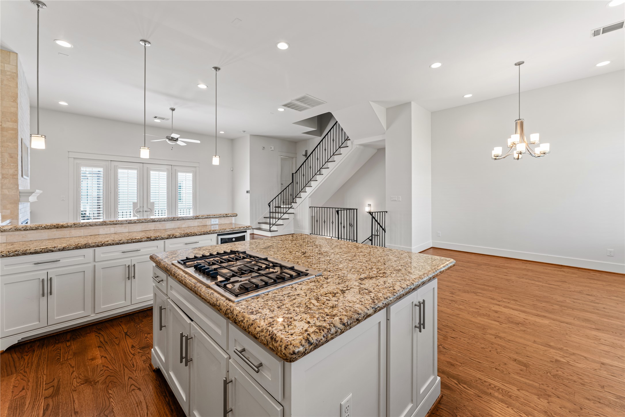 4938 Edison Park Lane Houston, TX 77081 - Photo 18 of 49 a kitchen with stainless steel appliances granite countertop a sink stove and wooden floor