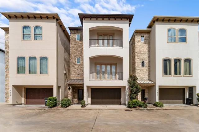 a front view of a house with yard