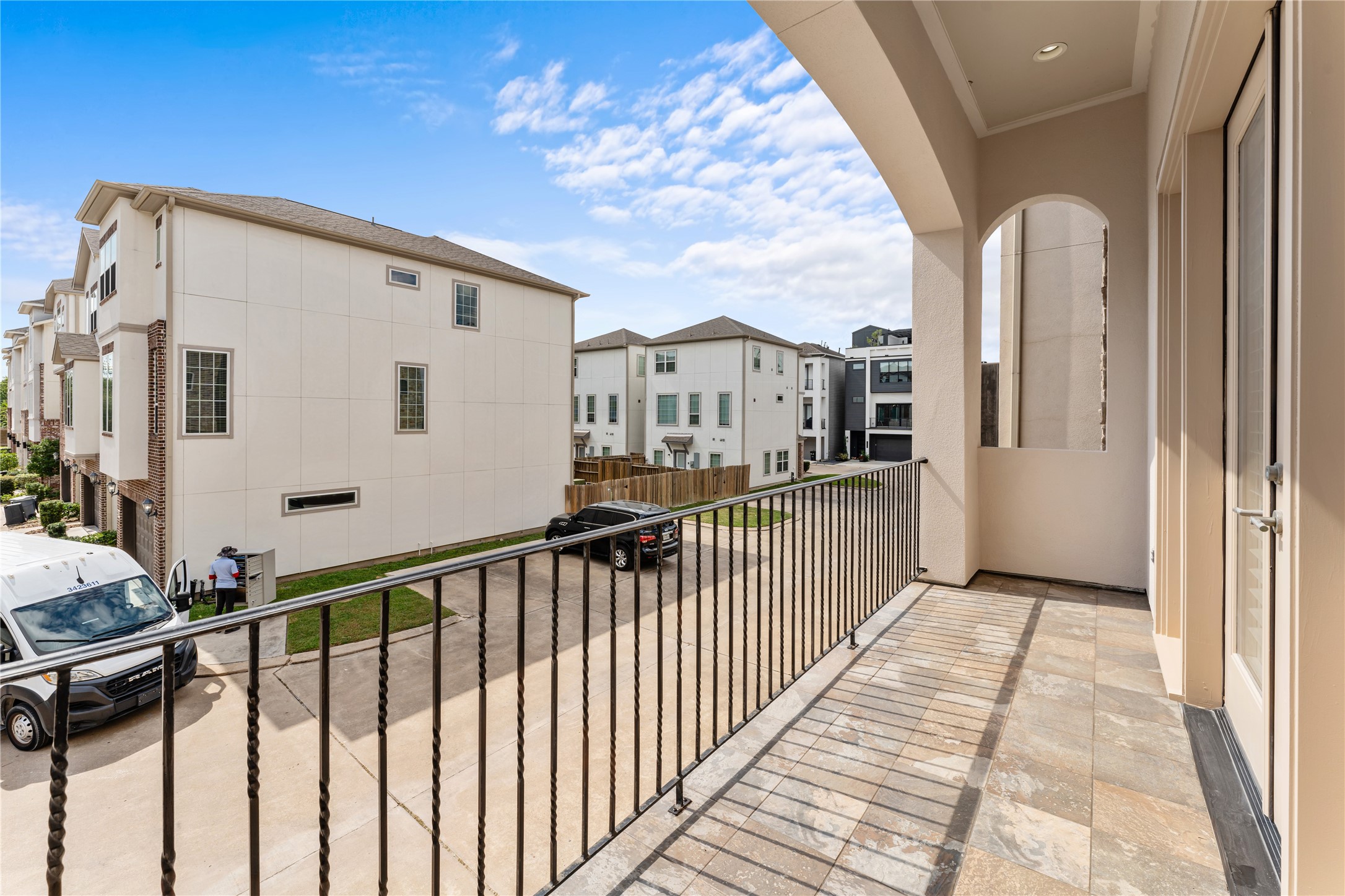 4938 Edison Park Lane Houston, TX 77081 - Photo 29 of 49 a view of a porch with wooden floor and fence