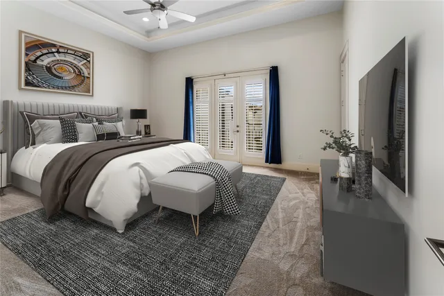 a spacious bedroom with a bed a mirror and a potted plant