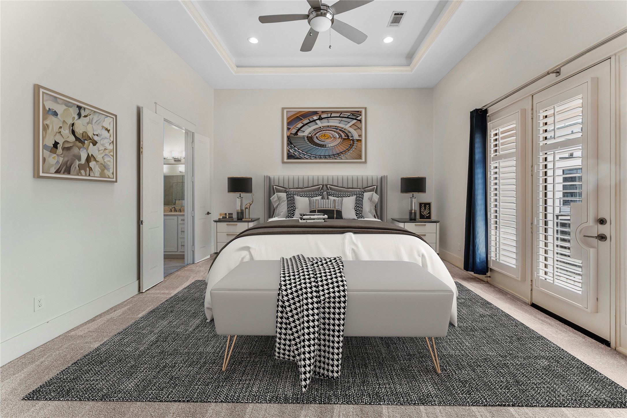 4938 Edison Park Lane Houston, TX 77081 - Photo 34 of 49 a bedroom with a large bed and a chandelier