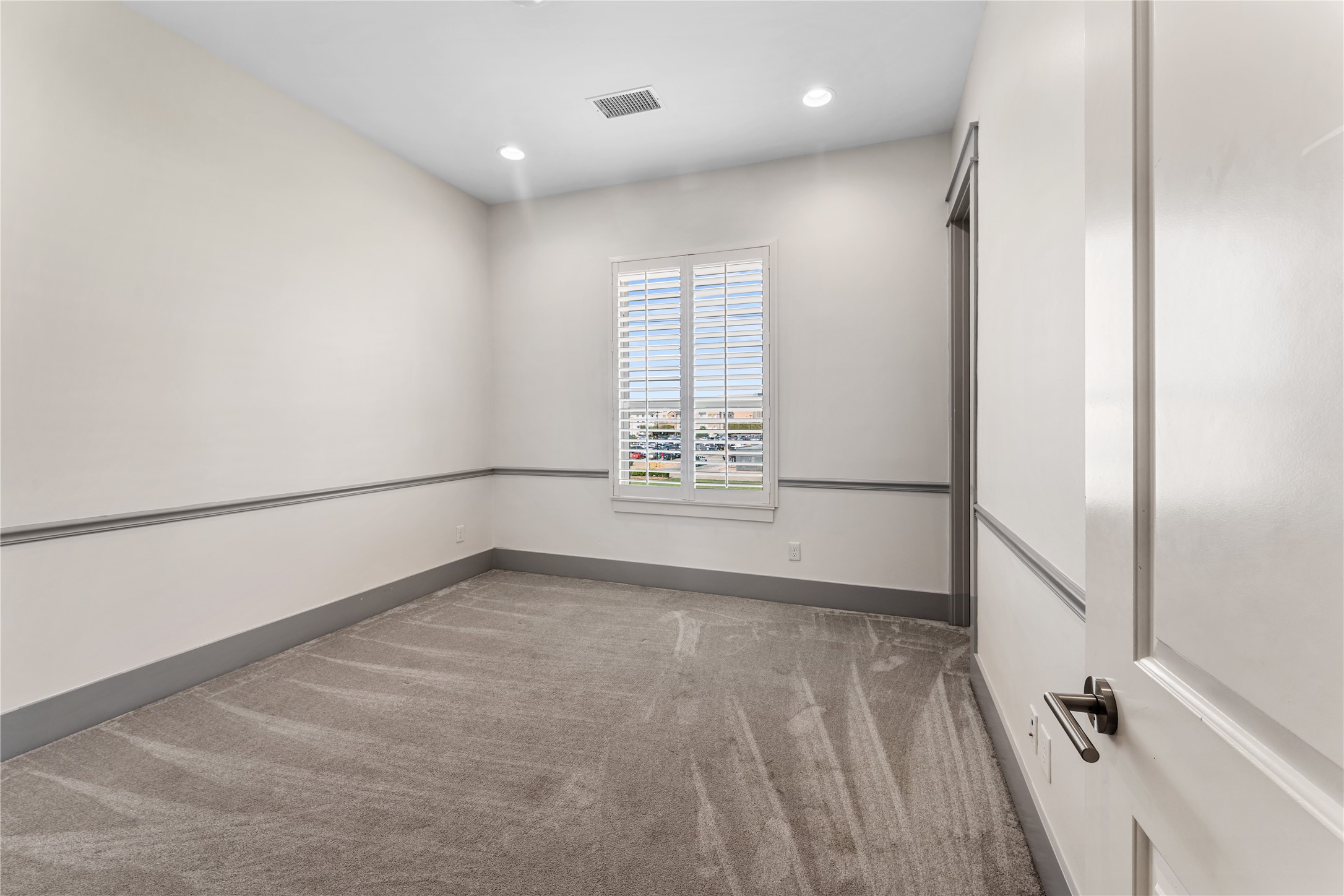 4938 Edison Park Lane Houston, TX 77081 - Photo 44 of 49 a view of an empty room with a window