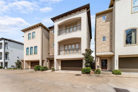 a front view of a house with yard