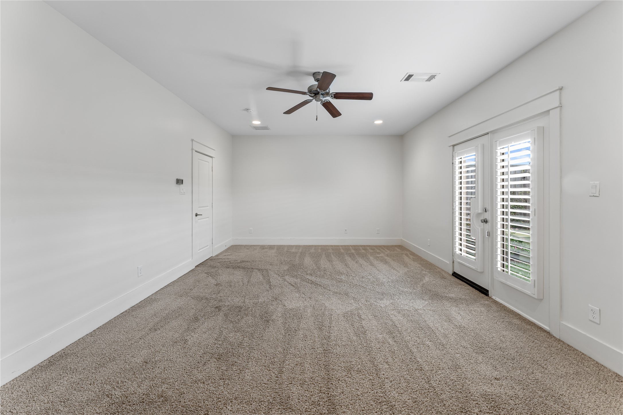 4938 Edison Park Lane Houston, TX 77081 - Photo 8 of 49 wooden floor in an empty room with a window