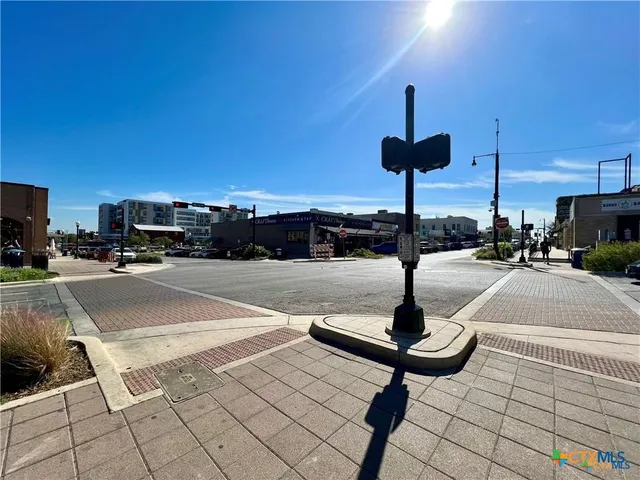 a swimming pool with outdoor seating and city view
