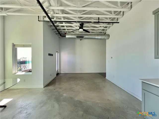 a view of a room with an empty space