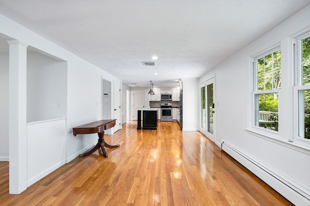 3 Chatham Circle Hingham, MA 02043 - Photo 26 of 36 a view of a living room filled with furniture and wooden floor