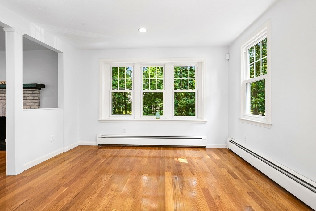 3 Chatham Circle Hingham, MA 02043 - Photo 31 of 36 a view of an empty room with wooden floor and a window