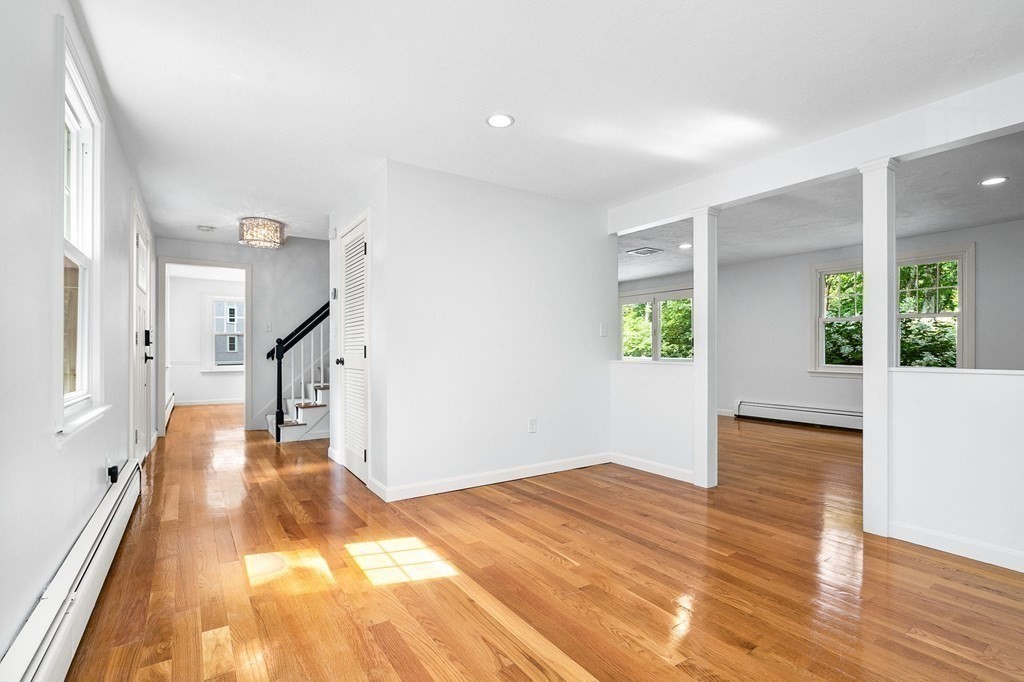 3 Chatham Circle Hingham, MA 02043 - Photo 32 of 36 a view of a big room with wooden floor and windows
