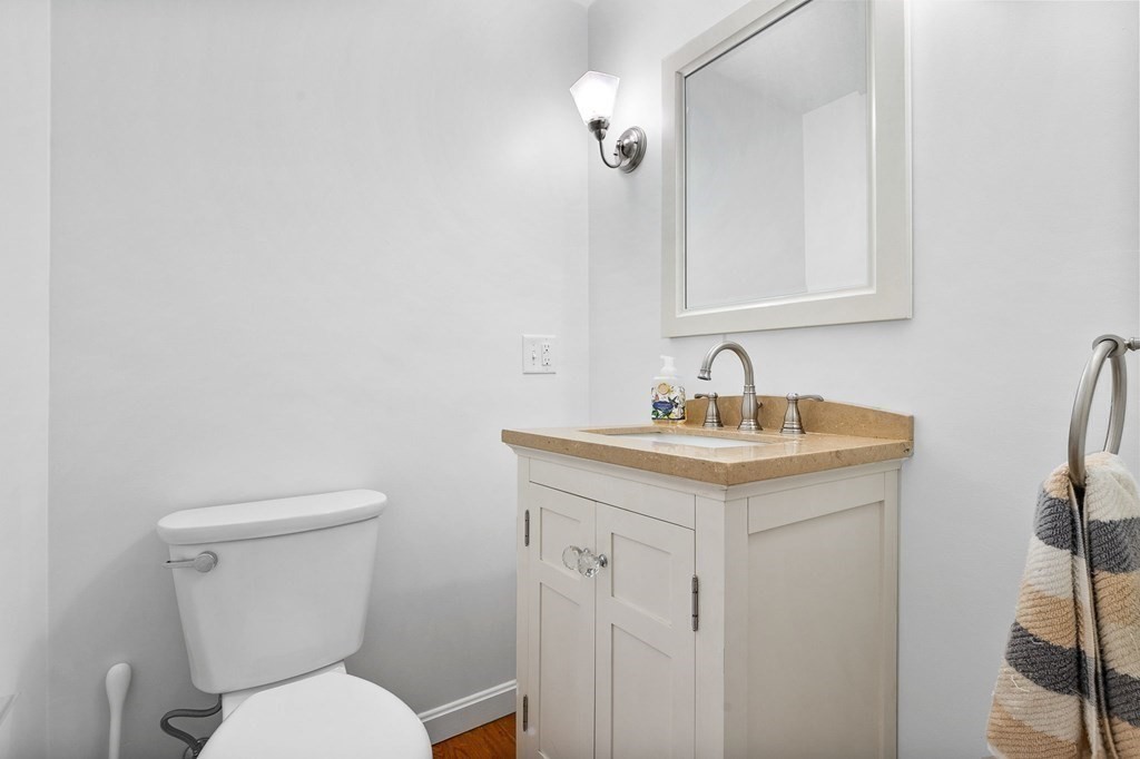 3 Chatham Circle Hingham, MA 02043 - Photo 33 of 36 a bathroom with a toilet sink and mirror