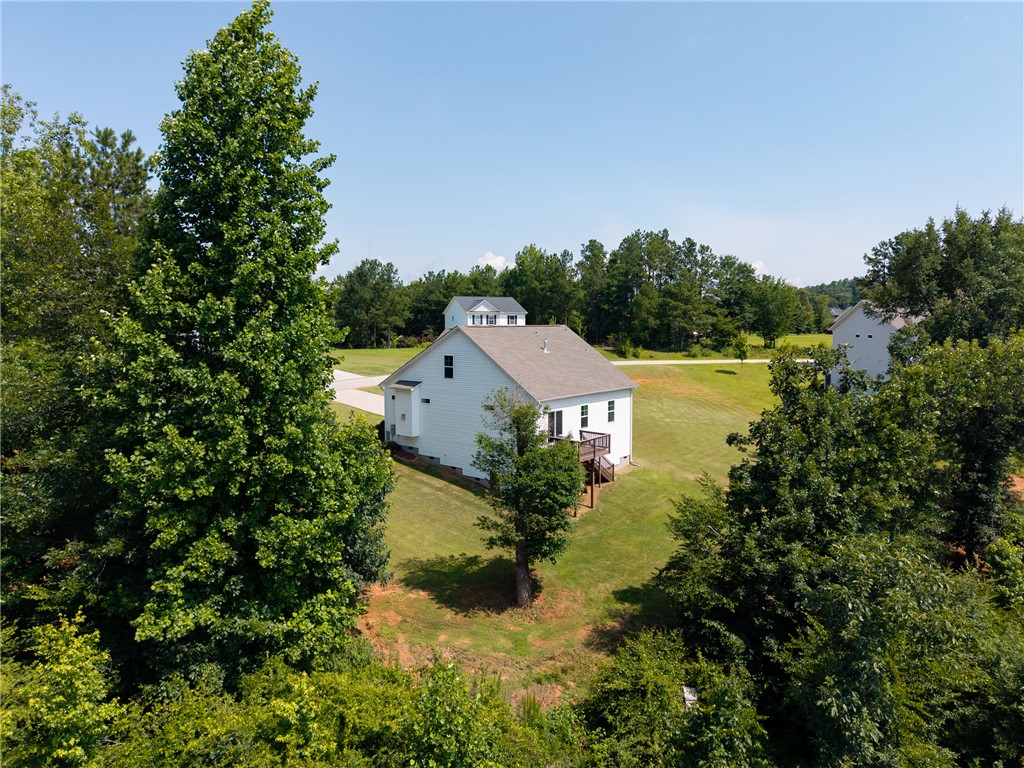 768 Rocky Ridge Circle Seneca, SC 29678 - Photo 29 of 30 A private, secluded residence nestled amongst verdant trees, offering tranquil outdoor living.