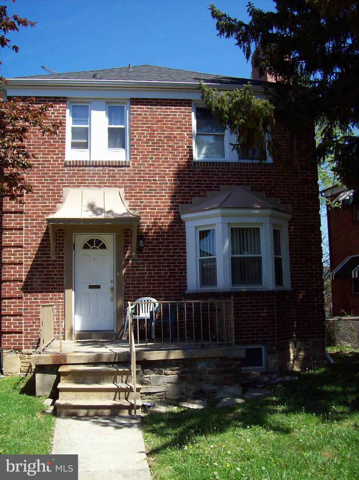 1534 Northwick Road Baltimore, MD 21218 - Photo 1 of 12 a front view of a house with garden