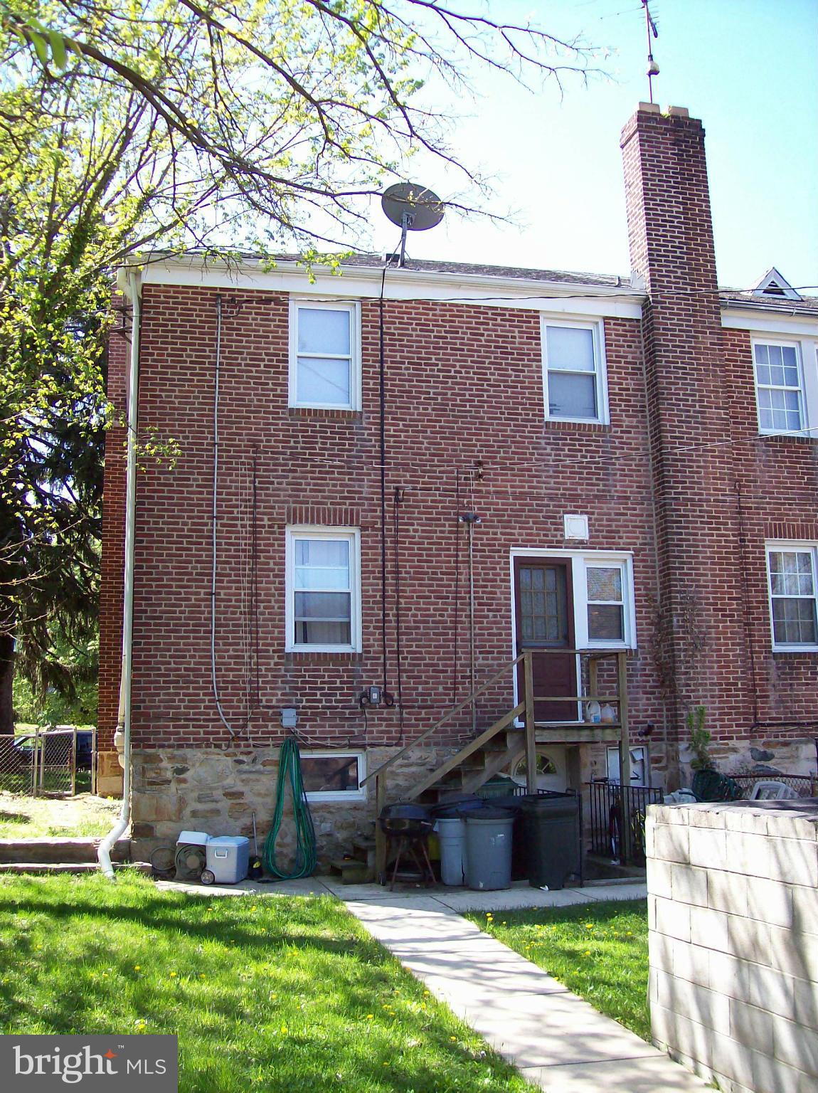 1534 Northwick Road Baltimore, MD 21218 - Photo 2 of 12 a front view of a house with garden