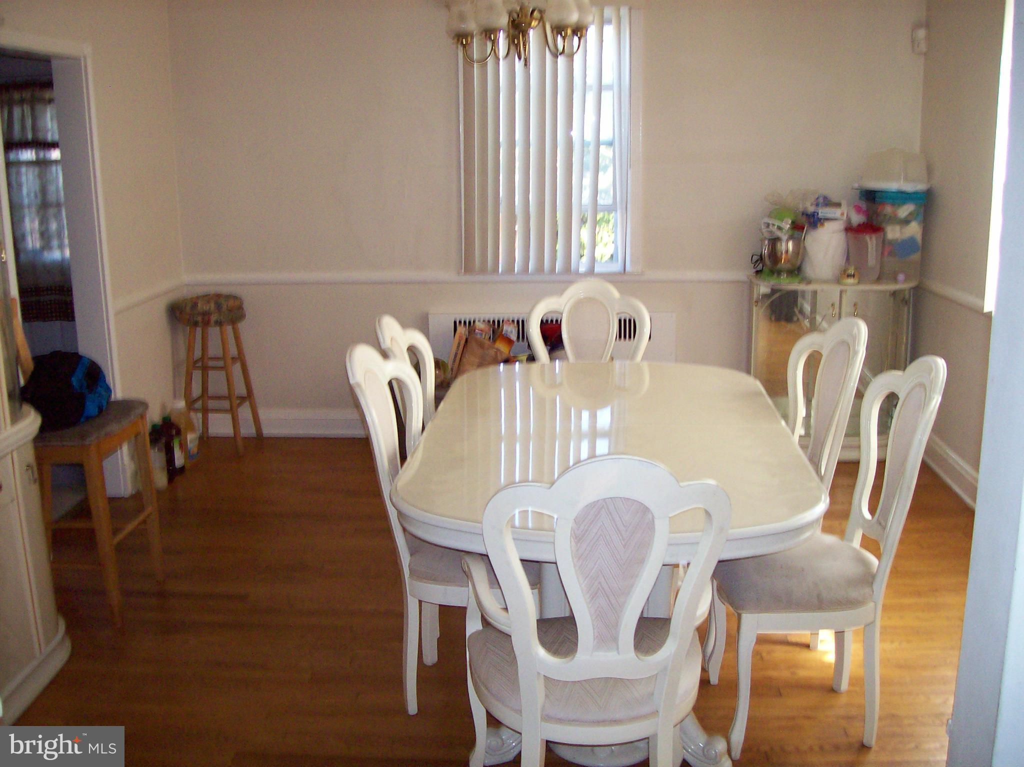 1534 Northwick Road Baltimore, MD 21218 - Photo 4 of 12 a view of a dining room with furniture window and outside view