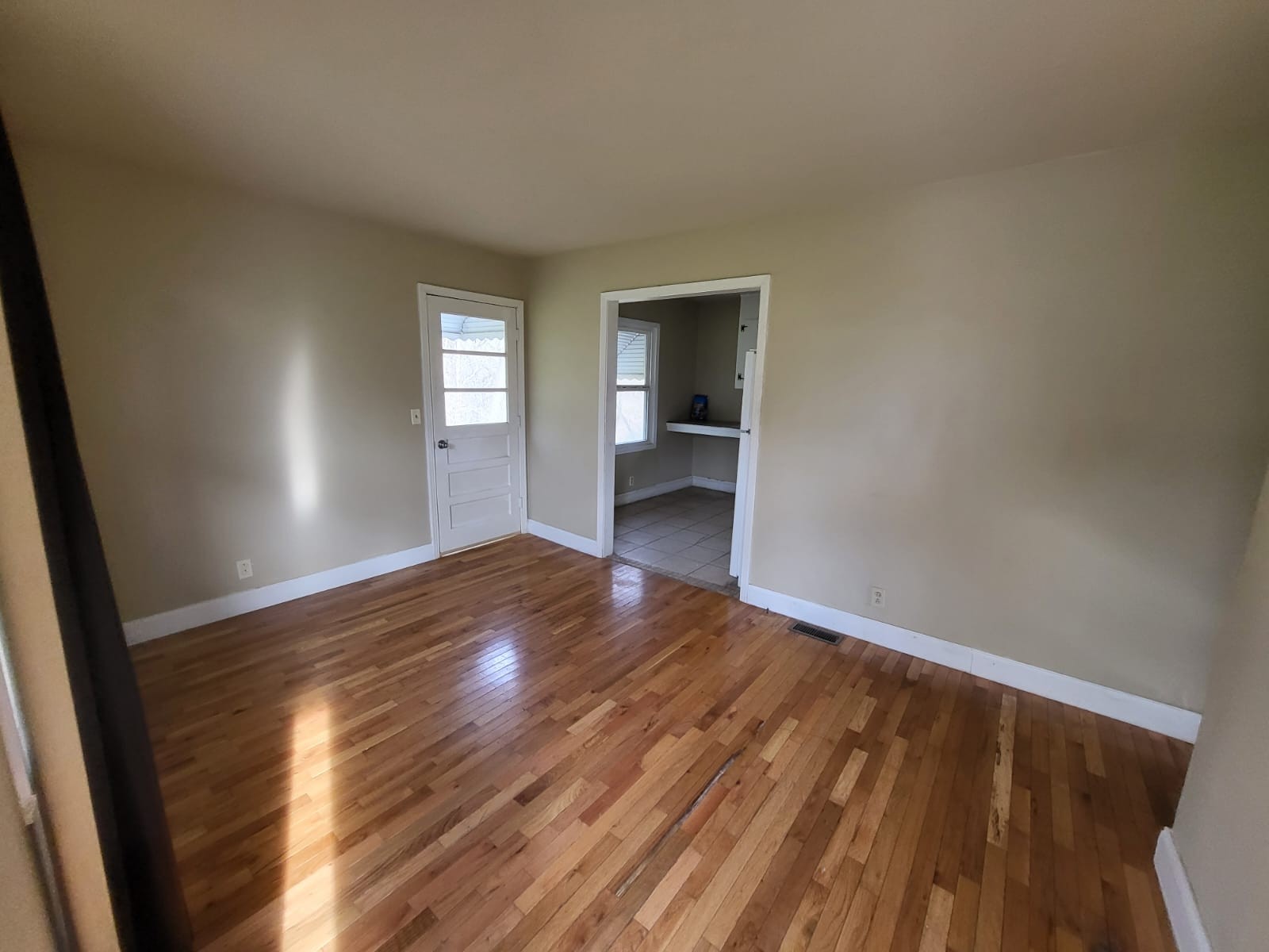 721 9th Street Clarksville, TN 37040 - Photo 2 of 7 a view of empty room with wooden floor and fan