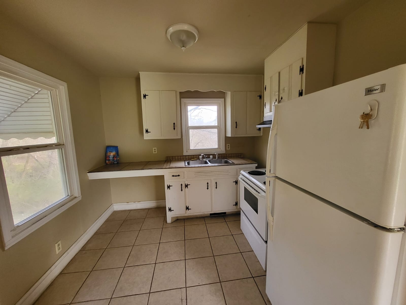 721 9th Street Clarksville, TN 37040 - Photo 3 of 7 a kitchen with a cabinets and white appliances