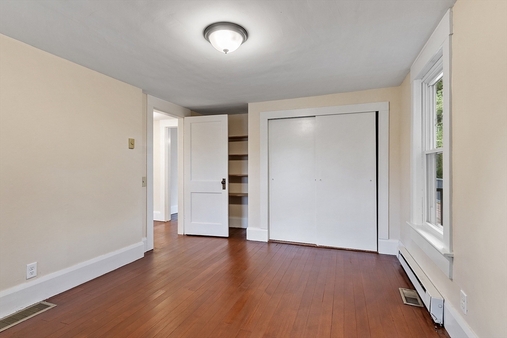 175 Petersham Road Phillipston, MA 01331 - Photo 12 of 42 an empty room with wooden floor and closet