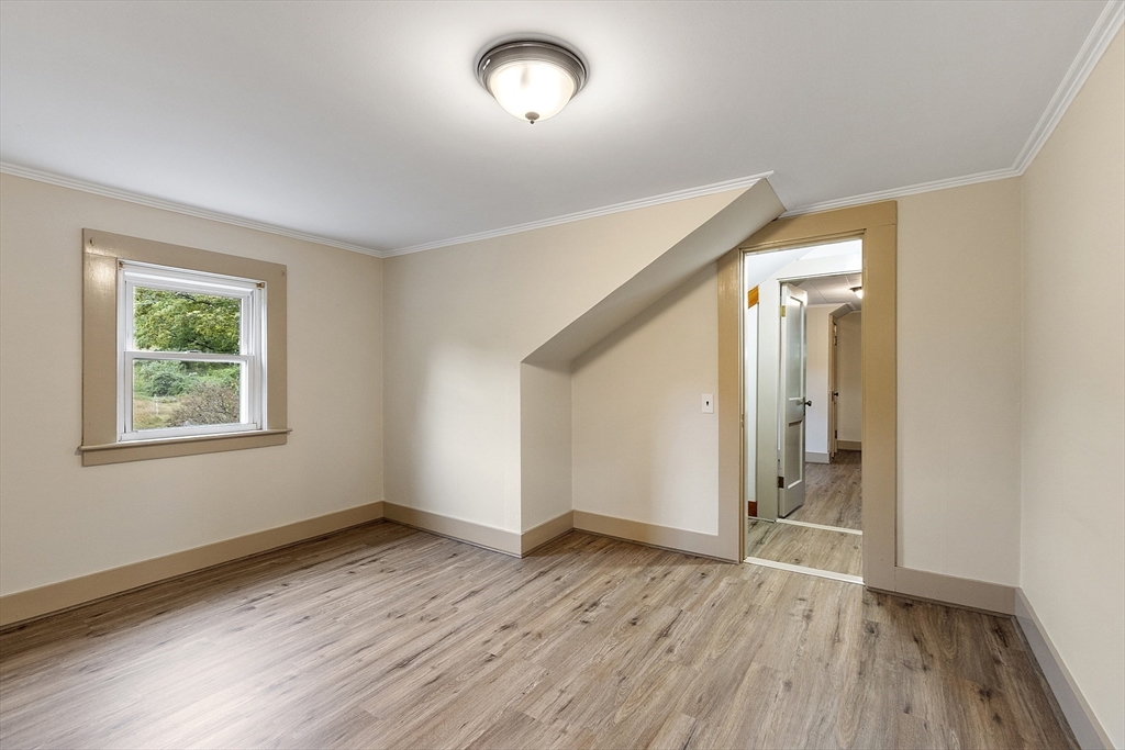 175 Petersham Road Phillipston, MA 01331 - Photo 22 of 42 an empty room with wooden floor and windows
