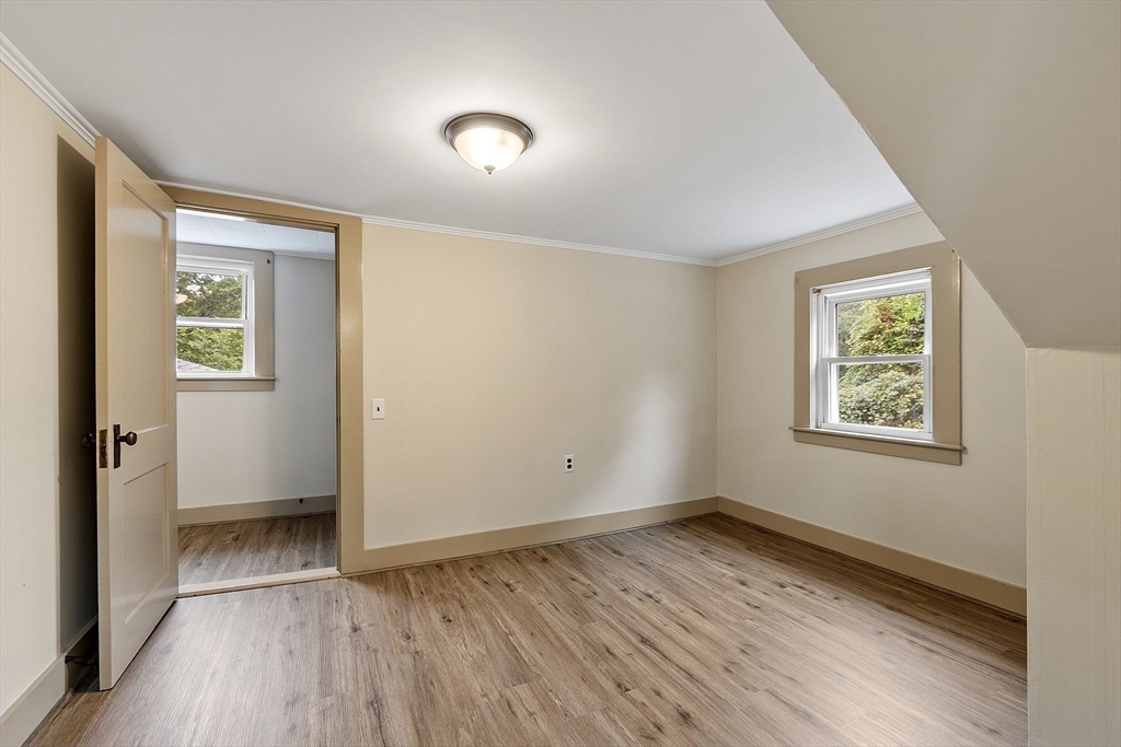 175 Petersham Road Phillipston, MA 01331 - Photo 23 of 42 an empty room with wooden floor and windows