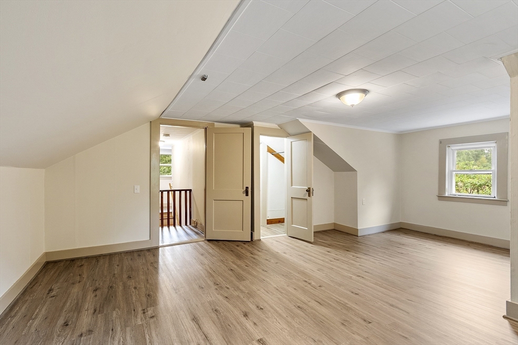 175 Petersham Road Phillipston, MA 01331 - Photo 25 of 42 an empty room with wooden floor and windows