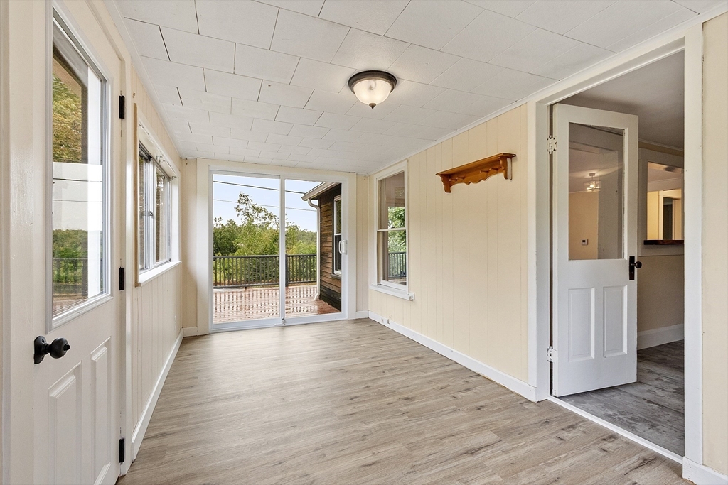 175 Petersham Road Phillipston, MA 01331 - Photo 27 of 42 a view of a big room with wooden floor and windows