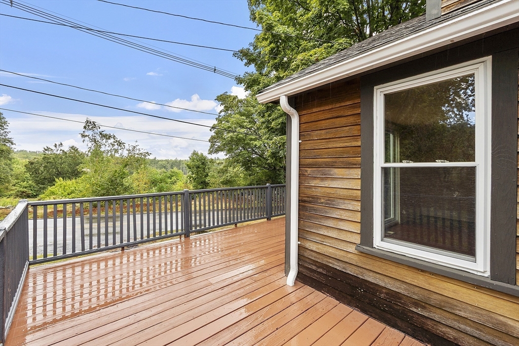 175 Petersham Road Phillipston, MA 01331 - Photo 39 of 42 a view of a wooden balcony with a door and wooden floor