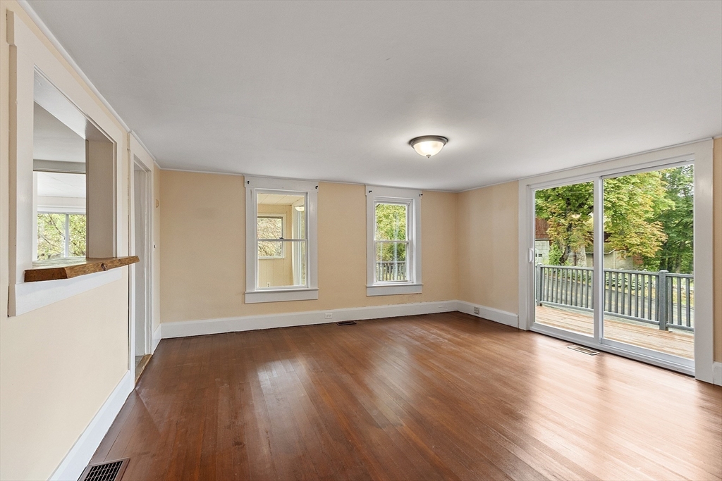 175 Petersham Road Phillipston, MA 01331 - Photo 9 of 42 a view of an empty room with wooden floor and a window