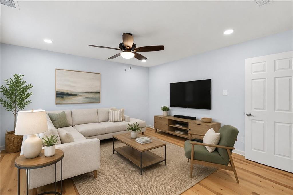 1745 Rockbridge Road Northwest Conyers, GA 30012 - Photo 5 of 32 a living room with furniture and a flat screen tv