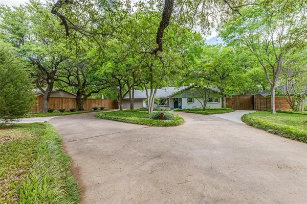 a house with trees in front of it