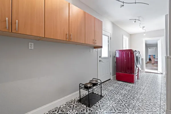 a room with a couch and cabinets