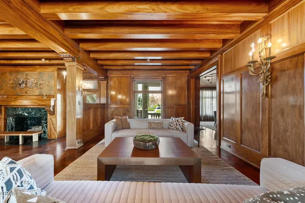 a large bedroom with bed and a fireplace