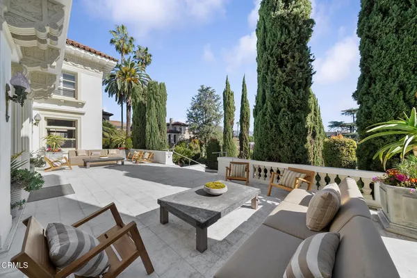 a bathroom with a toilet a sink and glass door