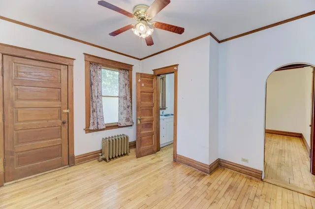 a view of an empty room with a window