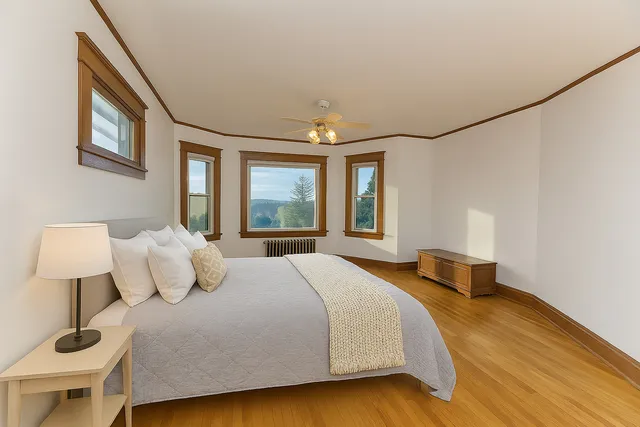 a bedroom with a bed and window