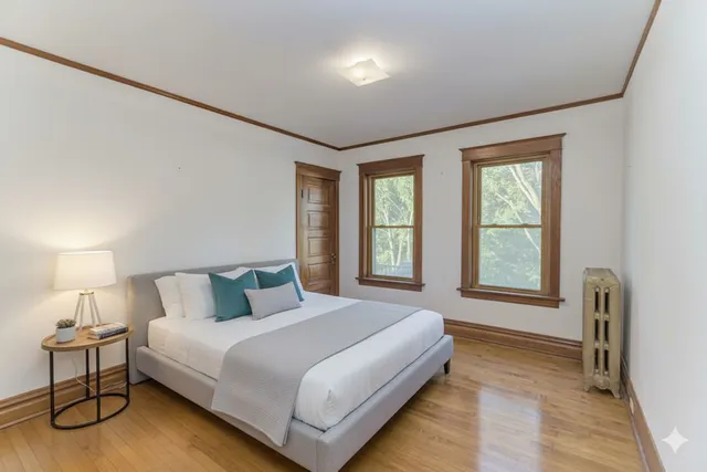 a bedroom with a bed and window