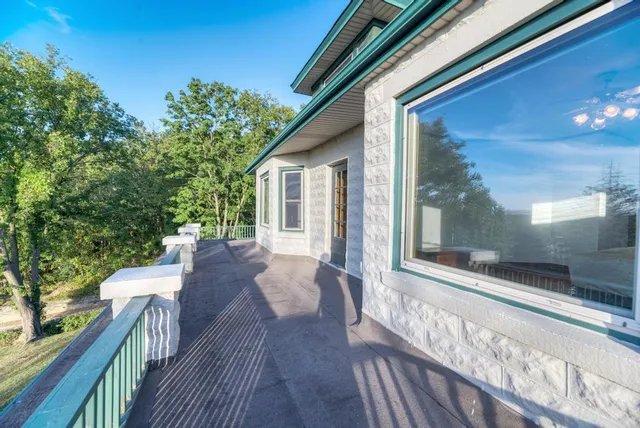 a view of a house with backyard and porch