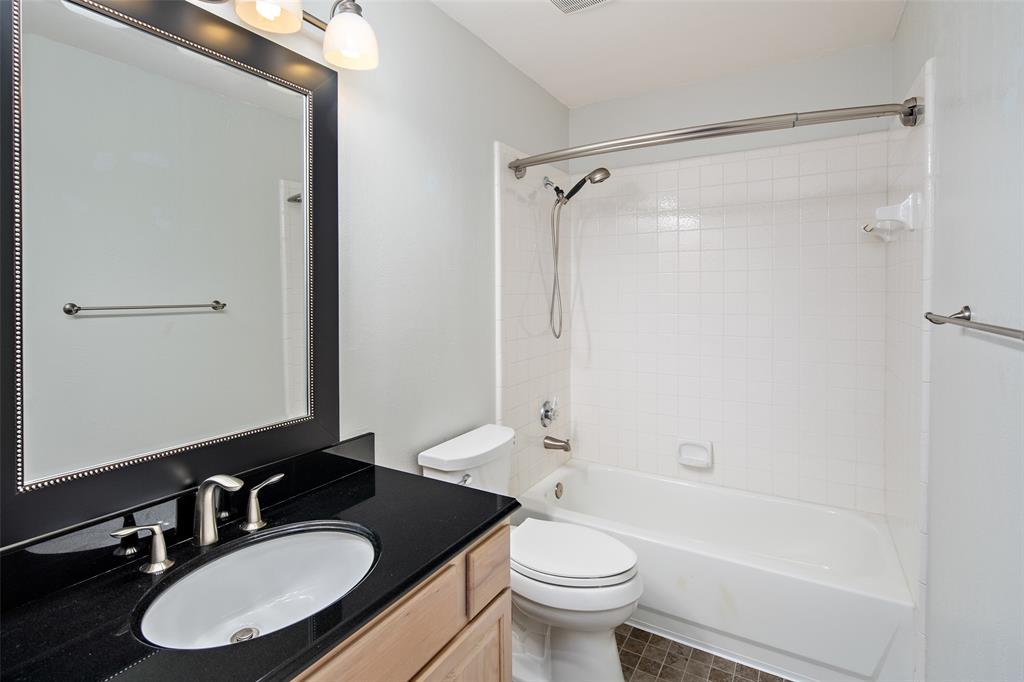 103 Sierra Court Allen, TX 75013 - Photo 15 of 28 a bathroom with a sink and a mirror