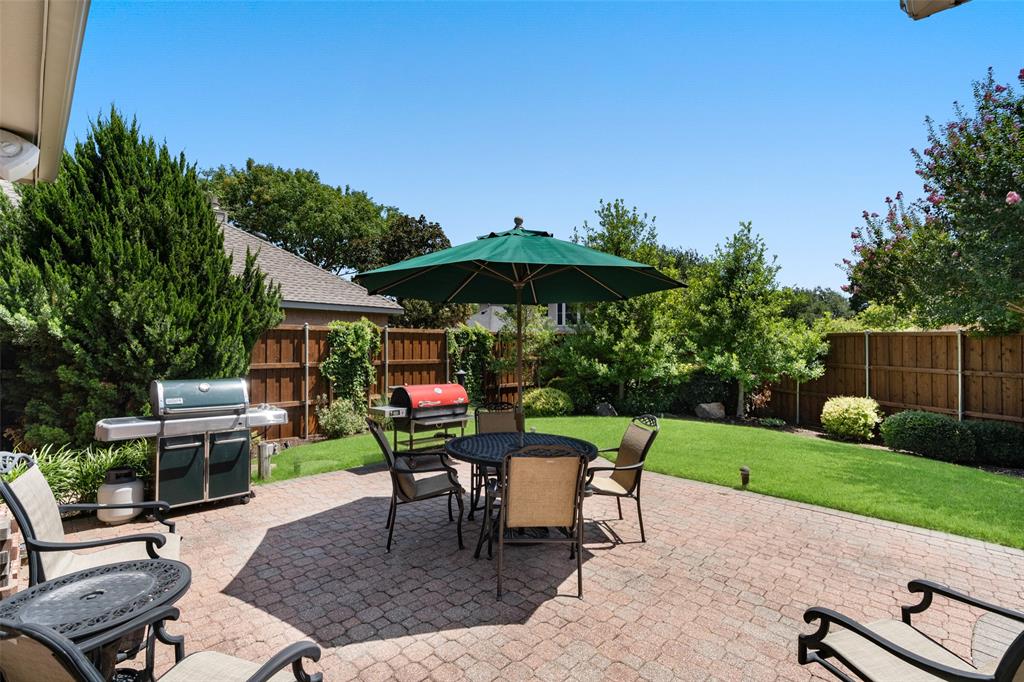 103 Sierra Court Allen, TX 75013 - Photo 18 of 28 a view of backyard with outdoor seating a patio and plants