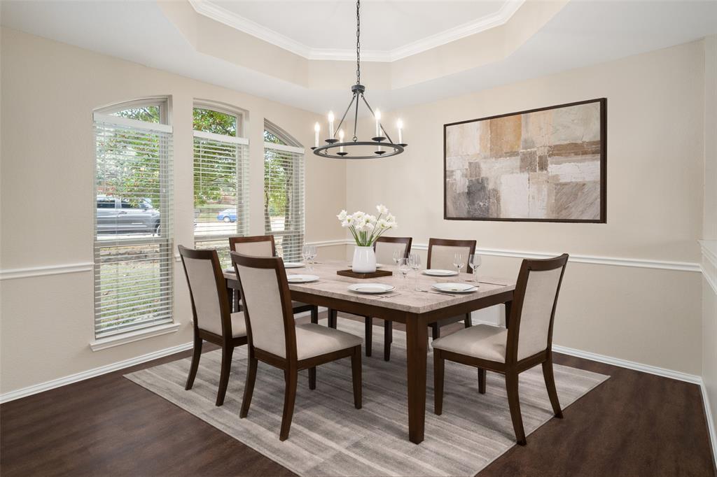103 Sierra Court Allen, TX 75013 - Photo 3 of 28 a view of a dining room with furniture window and wooden floor