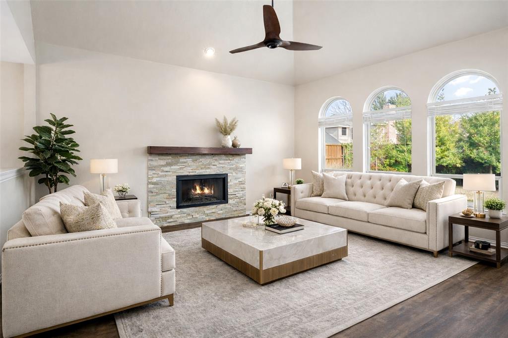 103 Sierra Court Allen, TX 75013 - Photo 4 of 28 a living room with furniture and a fireplace