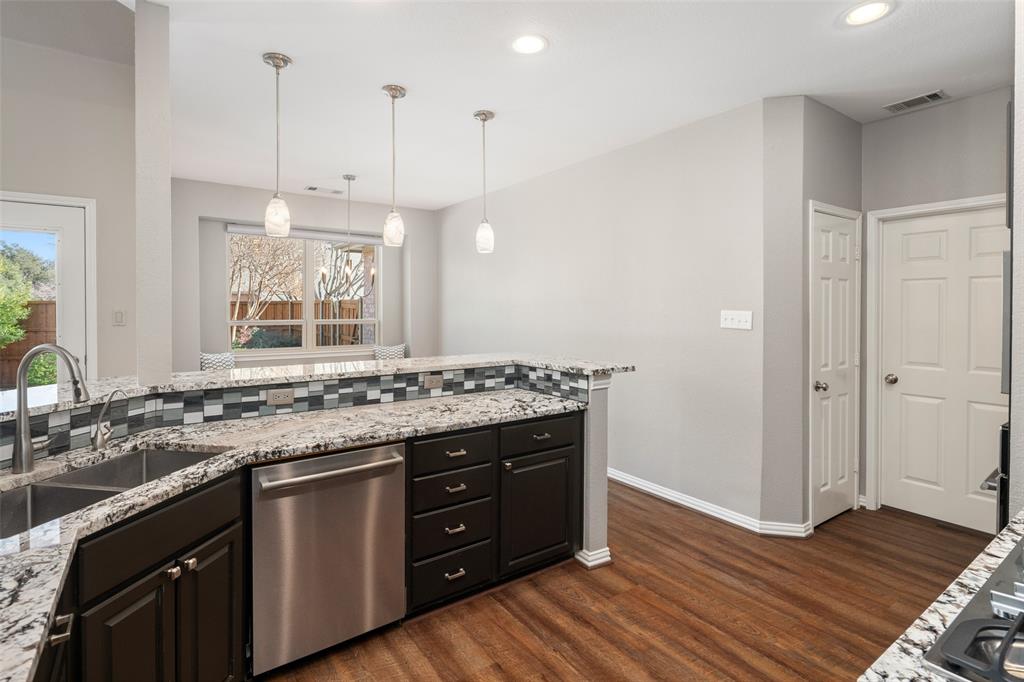 103 Sierra Court Allen, TX 75013 - Photo 6 of 28 a kitchen with a stove sink and wooden floor