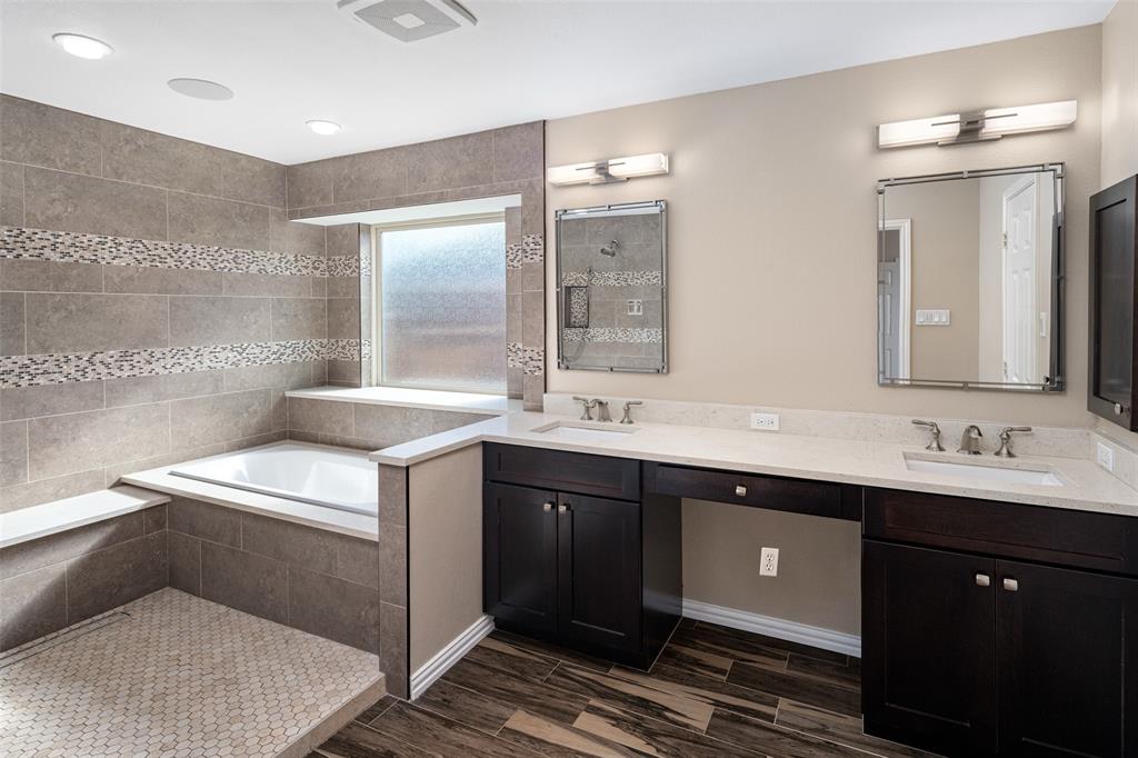 103 Sierra Court Allen, TX 75013 - Photo 10 of 28 a spacious bathroom with a sink double vanity and a mirror