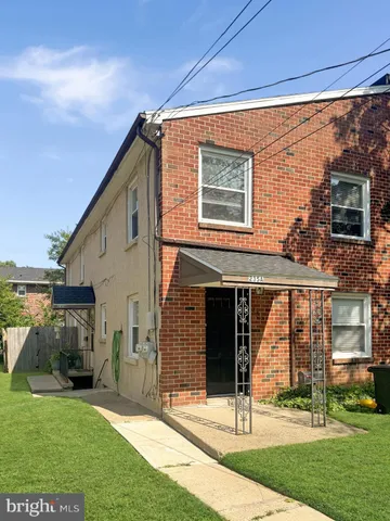a view of house with yard