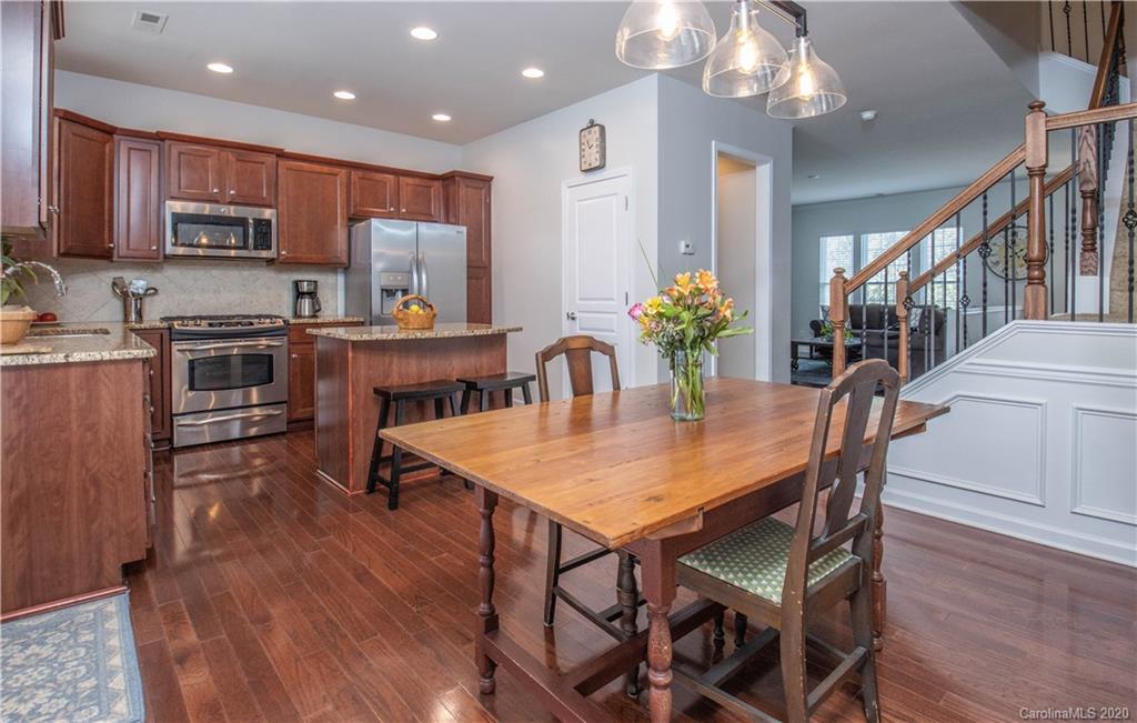 903 Lyndley Drive Fort Mill, SC 29708 - Photo 13 of 47 a view of a dining room with furniture and wooden floor