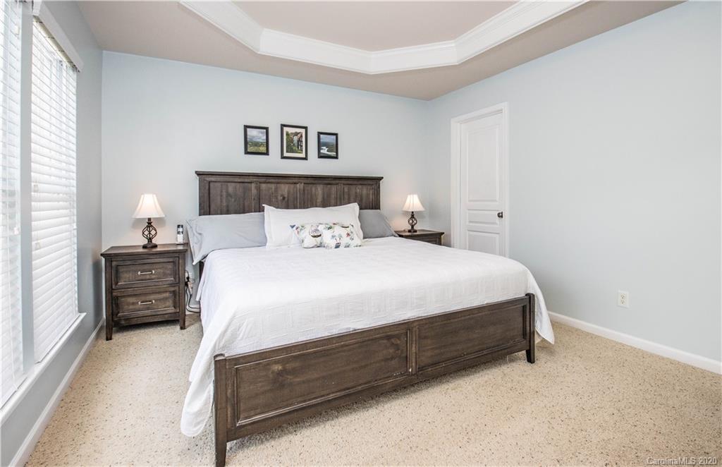 903 Lyndley Drive Fort Mill, SC 29708 - Photo 15 of 47 a bed room with a bed and a night stand