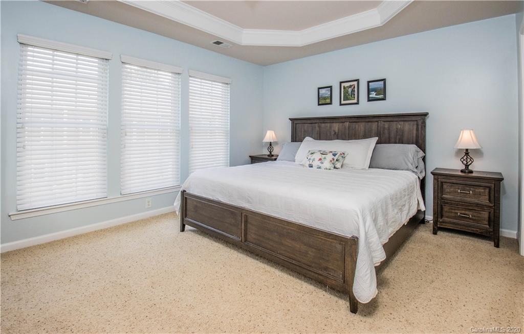 903 Lyndley Drive Fort Mill, SC 29708 - Photo 16 of 47 a bedroom with a bed and a night stand