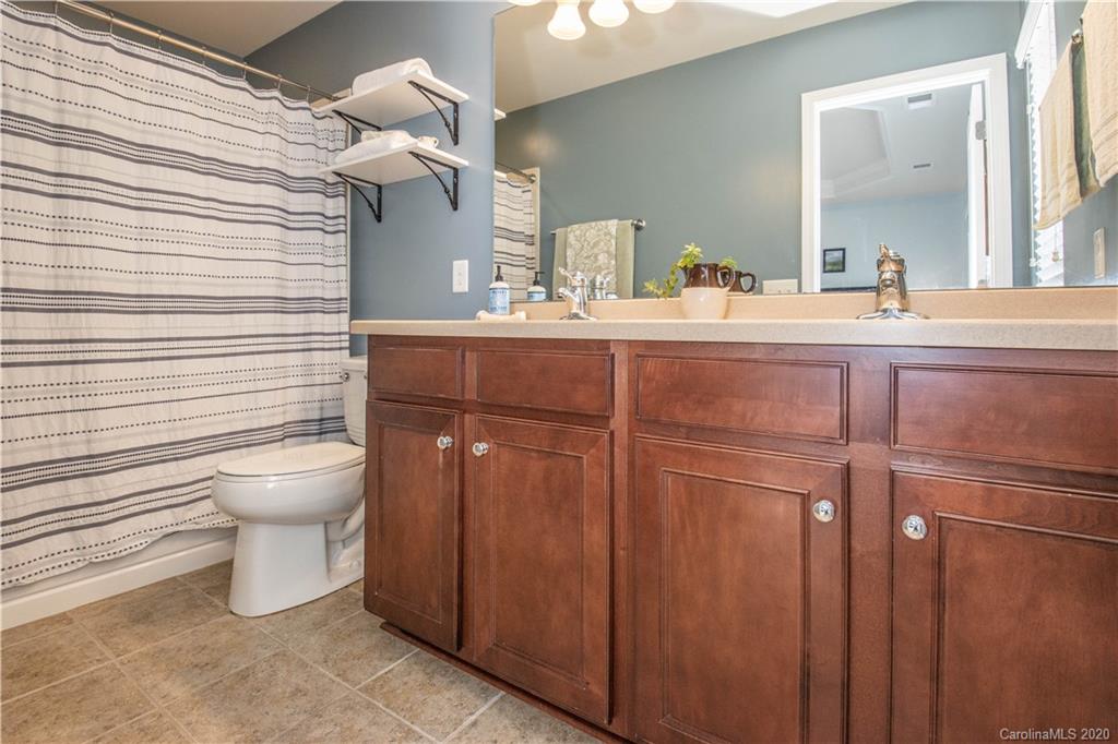 903 Lyndley Drive Fort Mill, SC 29708 - Photo 17 of 47 a bathroom with a toilet sink and mirror