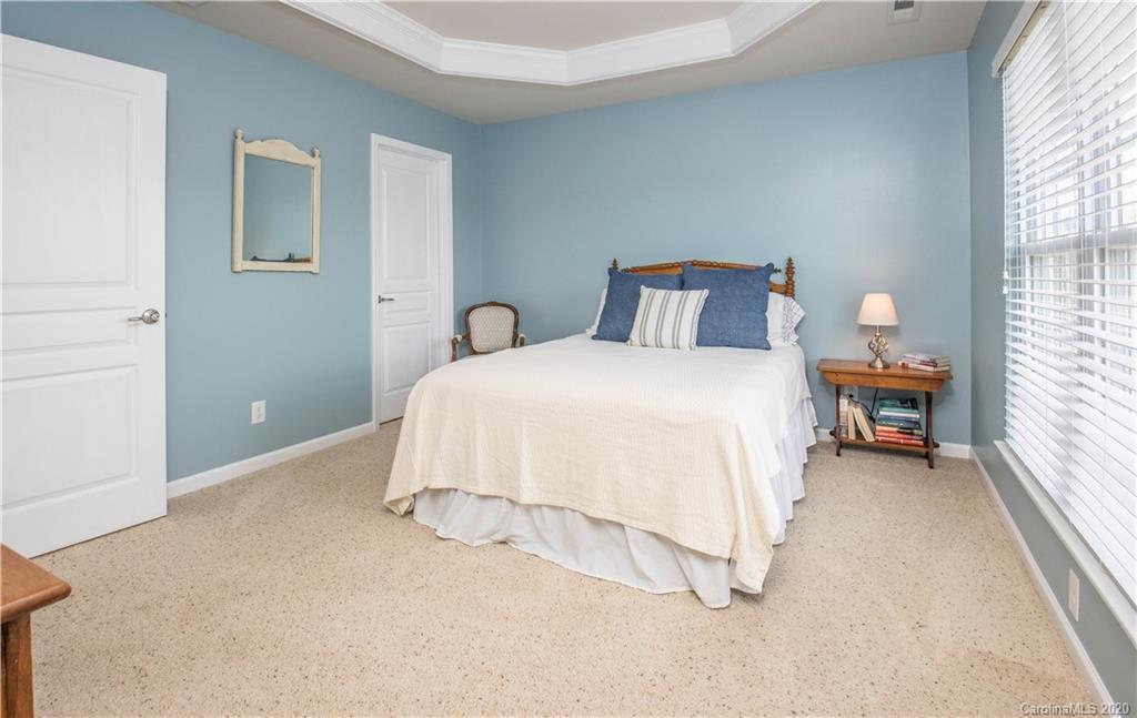 903 Lyndley Drive Fort Mill, SC 29708 - Photo 18 of 47 a bedroom with a bed and a large window