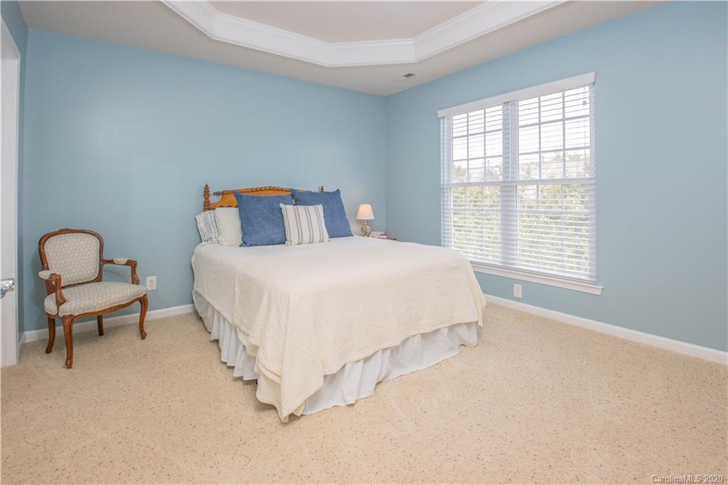 903 Lyndley Drive Fort Mill, SC 29708 - Photo 19 of 47 a bedroom with a bed and a couch